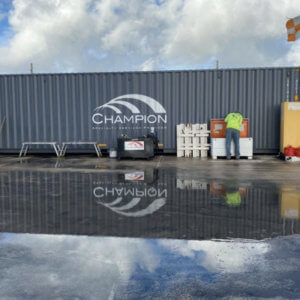 Cargo container with Champion Painting Specialty Services Corp. in white on gray background
