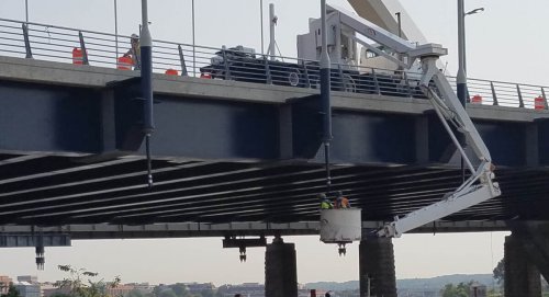 Men working on Frederick Douglass Memorial Bridge